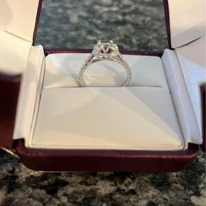 Halo style engagement ring